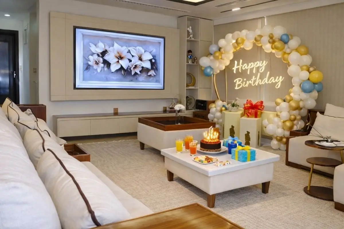 Indoor lounge of the Lavy Luxury Yacht with cream sofas, a framed floral panel and a decorated corner with a neon sign